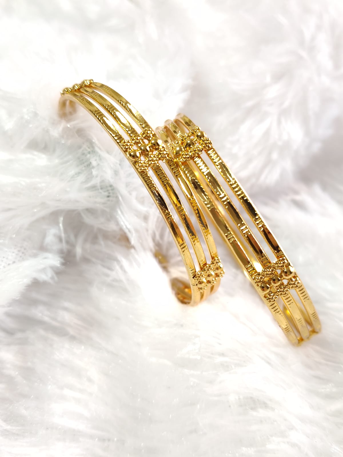 Golden Grace Designer Bangles - Delicate Beauty in Every Detail